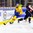 BUFFALO, NEW YORK - JANUARY 2: Sweden's Rasmus Dahlin #8 retrieves the puck ahead of Slovakia's Milos Kelemen #17 during the quarterfinal round of the 2018 IIHF World Junior Championship. (Photo by Andrea Cardin/HHOF-IIHF Images)

